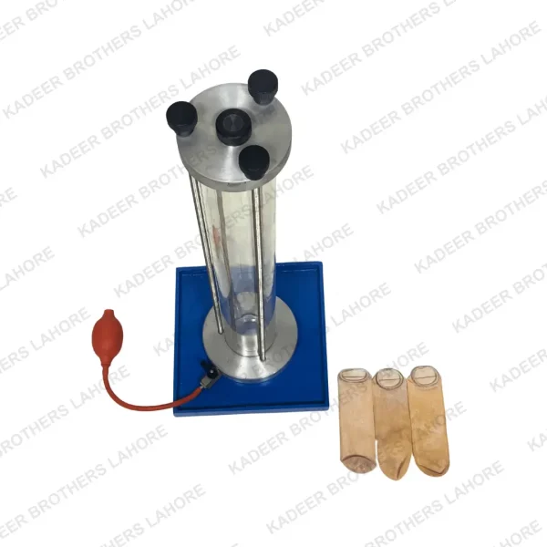 Balloon Density Apparatus featuring a transparent vertical cylinder, a base with a power cord, and three sample balloons placed alongside, designed for conducting density measurements in laboratory settings.