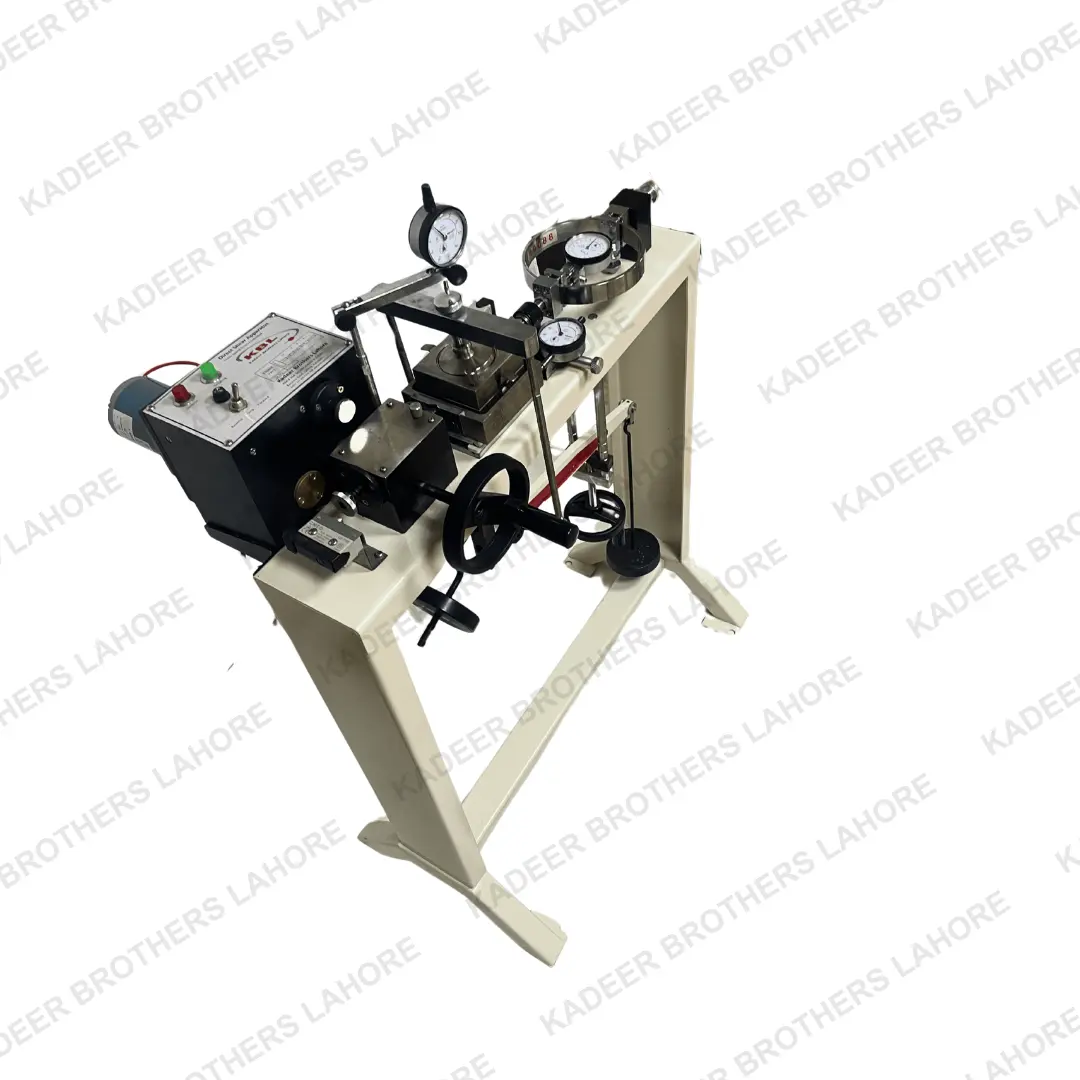 The motorized direct shear apparatus, showcasing its components including a shear box and pressure gauges, used for soil testing in laboratory conditions.